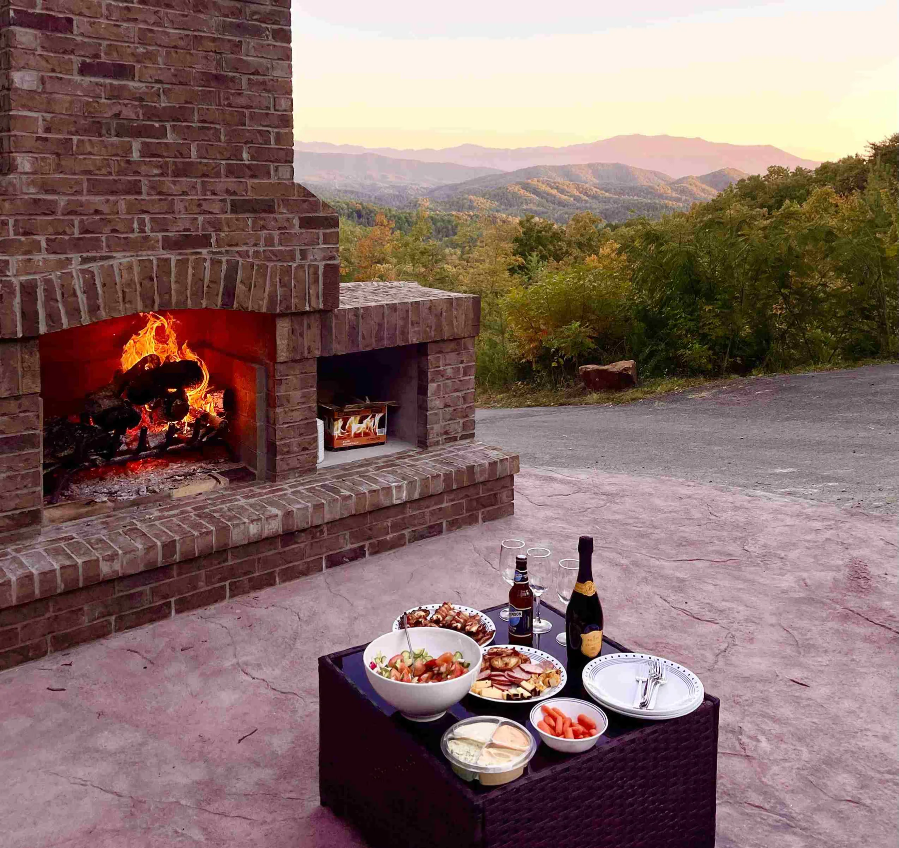 A fireside outdoor table set for a quiet evening in the mountains